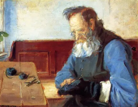 A Man Mending Socks