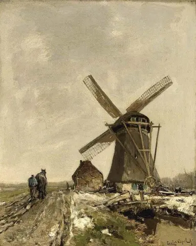 Eine Windmühle in einer verschneiten Landschaft