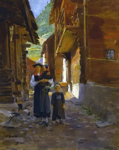 Giovane donna e bambini in un paesaggio montano