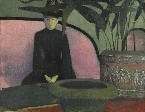 Kvinna som sitter på en rosa soffa ca 1887