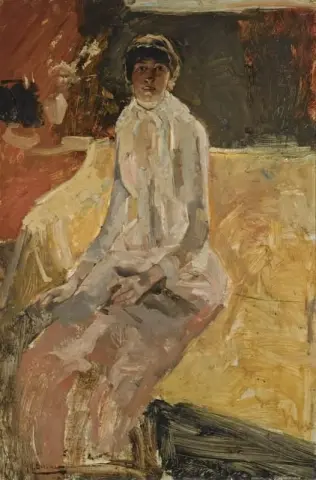 Istuva nainen ennen vuotta 1900