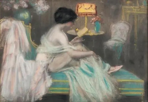 Woman Reading A Letter On A Couch