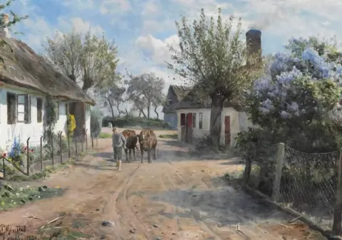 Spring Day In Lundby. A Shepherd Lad Leads Two Cows Through The Village