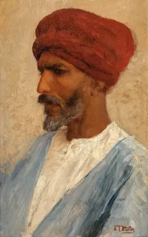 Mann i en rød turban