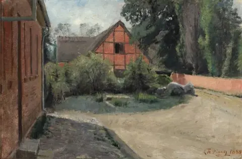 A Street In The Village Of Vejlo. To The Right The Cemetery Wall To The Left The School In The Background An Outhouse