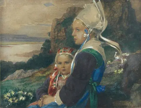 Bretonne y su chica en el paseo marítimo de la costa