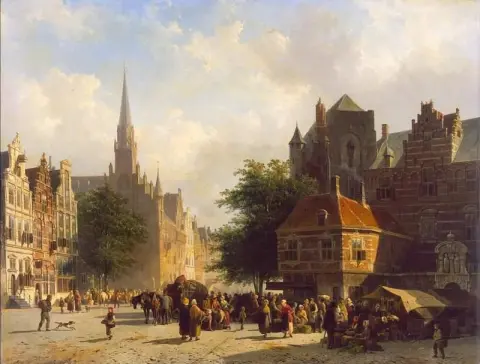 Market Day In A Dutch Town With Numerous Figures Conversing In A Square With Stalls And A Laden Cart And Horses
