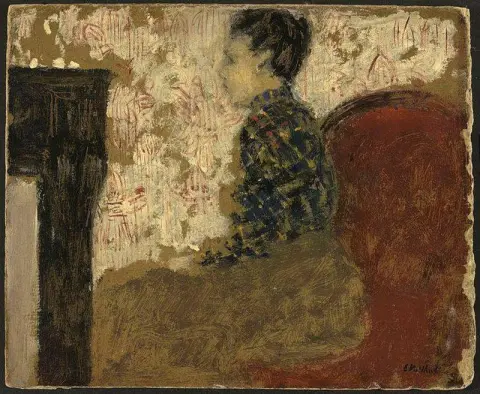 Kvinna som sitter vid brasan, ca. 1894